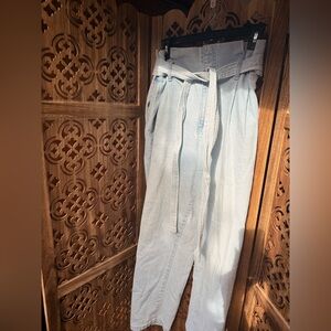 High waisted light wash jeans with jean matching belt